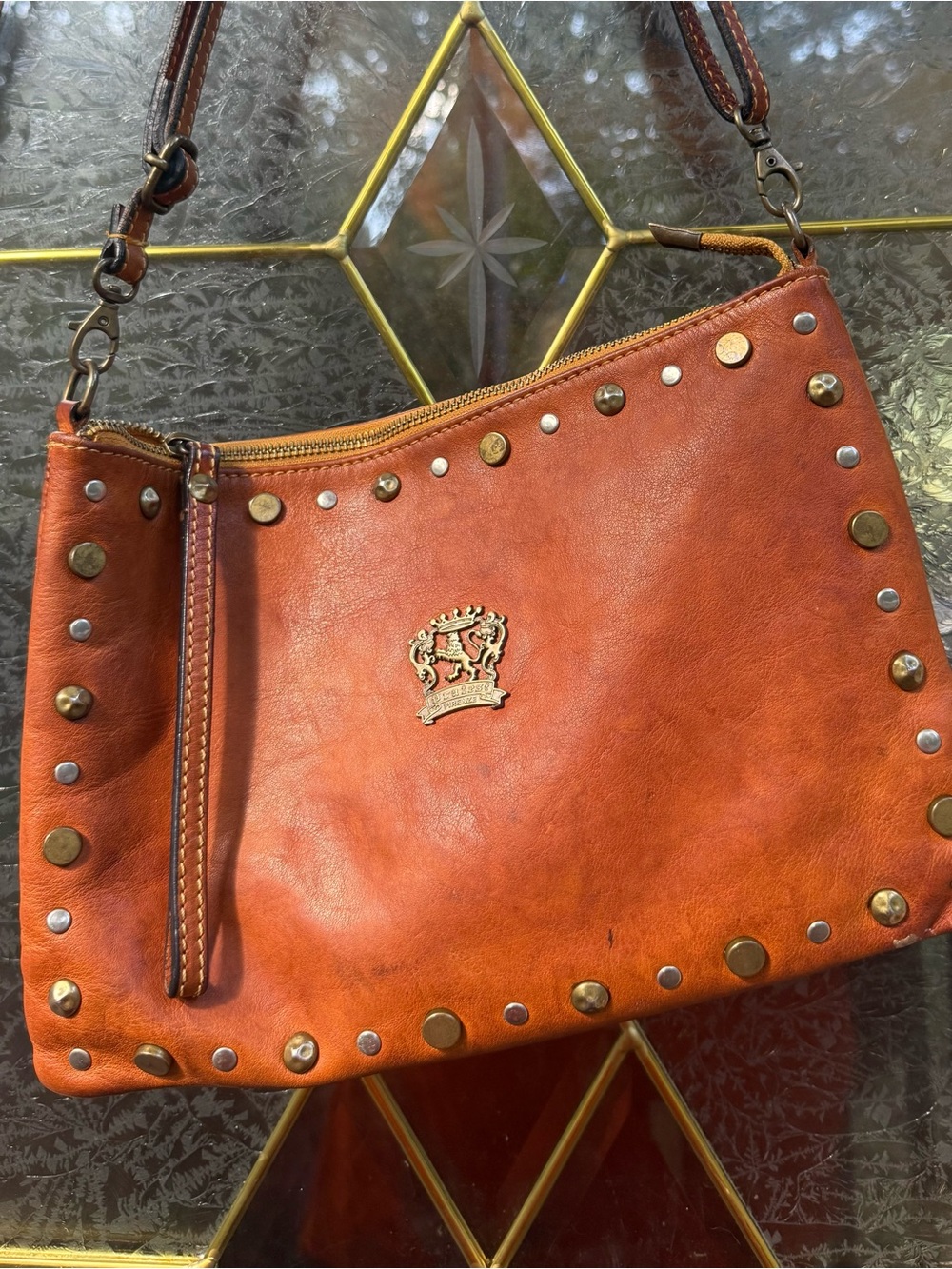 Studded Leather Shoulder Bag in Rust Brown with Crest Accent